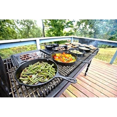 Lodge Cast Iron Skillet With Red Silicone Hot Handle Holder, 10.25 Inch