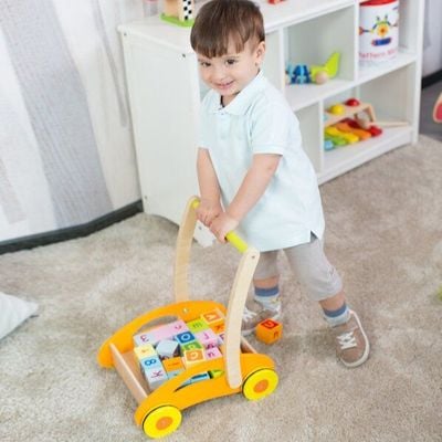 Classic World Walk & Play! Wooden Baby Walker with Activity Center it’s a first steps walker for babies with toys