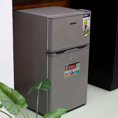 Geepas 125L Gross/85L Net Capacity, Double Door Defrost Refrigerator With Rapid Cooling Function, Tropic Type, CFC Free, Interior Lamp, Adjustable Leg, Hook & Key, Outside Condenser  Fridge - 60L/Freezer- 25L capacity GRF1259GPE Metallic grey Geepas 125L Gross/85L Net Capacity, Double Door Defrost Refrigerator With Rapid Cooling Function, Tropic Type, CFC Free, Interior Lamp, Adjustable Leg, Hook & Key, Outside Condenser  Fridge - 60L/Freezer- 25L capacity GRF1259GPE Metallic grey