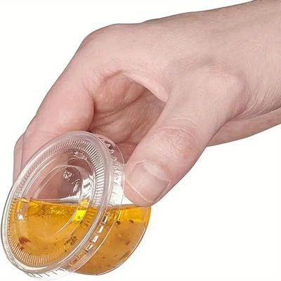 100Pcs Clear Disposable Plastic Portion 2Oz Cups with Lids Size  6x3 cm