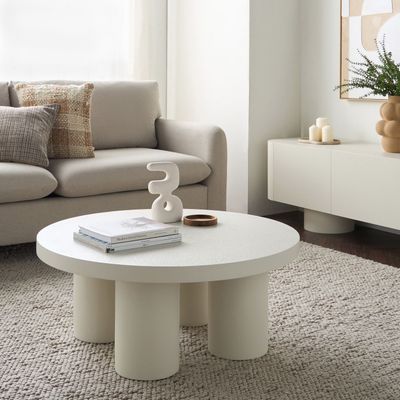 Ember Coffee Table – Luxury Round Center Table with Textured Finish & Cylindrical Leg Design