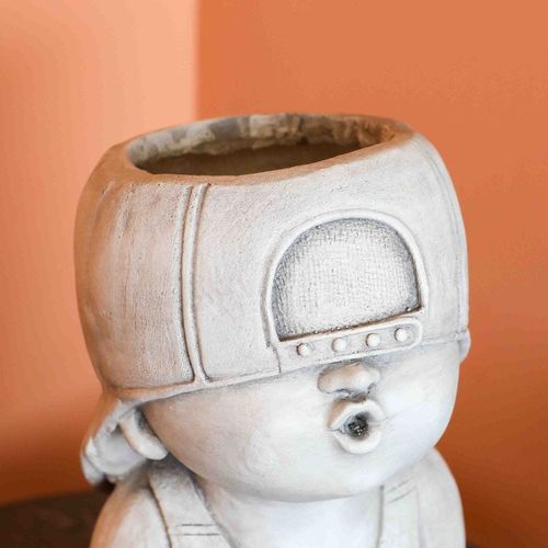 وعاء زرع مصنوع من أكسيد المغنيسيوم - تمثال على شكل صبي 
